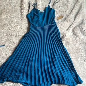 Rachel Roy, pleated dress. Never worn with tags. Beautiful deep teal color.